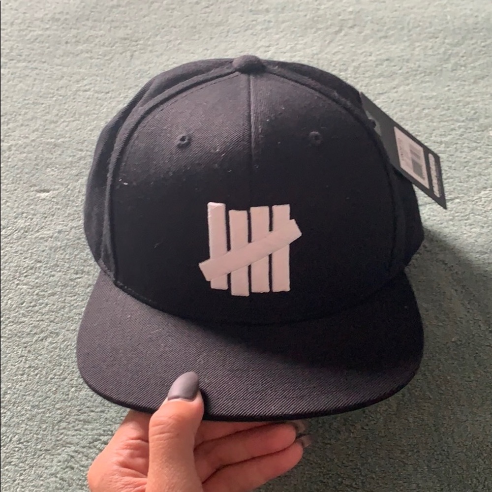 Brand new black Undefeated hat w/ tags